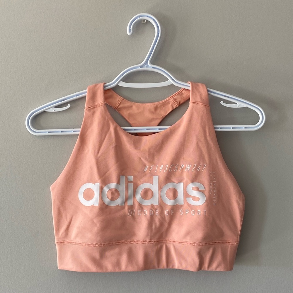 Trendy Adidas pale coral colored sports bra